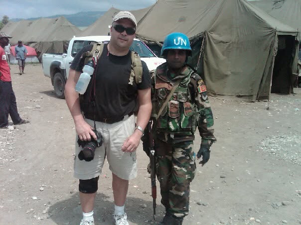 James with a UN peacekeeper in Haiti
